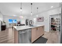 1411-220 Seton Grove Se, Calgary, AB  - Indoor Photo Showing Kitchen With Double Sink 