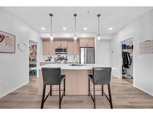 1411-220 Seton Grove Se, Calgary, AB - Indoor Photo Showing Kitchen With Stainless Steel Kitchen With Upgraded Kitchen