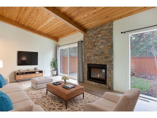 22-10030 Oakmoor Way Sw, Calgary, AB - Indoor Photo Showing Living Room With Fireplace