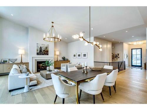 1055 Kerfoot Crescent Sw, Calgary, AB - Indoor Photo Showing Dining Room With Fireplace