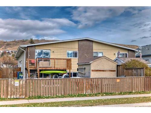 1-524 1 Street East, Cochrane, AB - Outdoor With Deck Patio Veranda