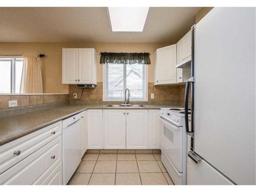 401-5000 Somervale Court Sw, Calgary, AB - Indoor Photo Showing Kitchen With Double Sink