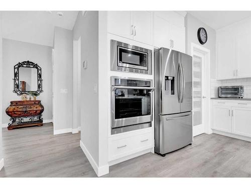 2137 Ravensdun Crescent Se, Airdrie, AB - Indoor Photo Showing Kitchen