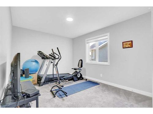 2137 Ravensdun Crescent Se, Airdrie, AB - Indoor Photo Showing Gym Room