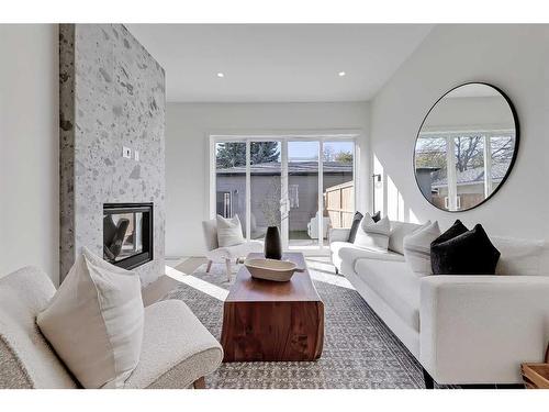 1033 Regal Crescent Ne, Calgary, AB - Indoor Photo Showing Living Room With Fireplace