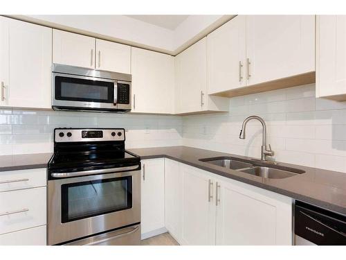 4313-99 Copperstone Park Se, Calgary, AB - Indoor Photo Showing Kitchen With Stainless Steel Kitchen With Double Sink With Upgraded Kitchen