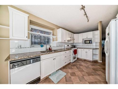 37 Christie Gardens Sw, Calgary, AB - Indoor Photo Showing Kitchen With Double Sink