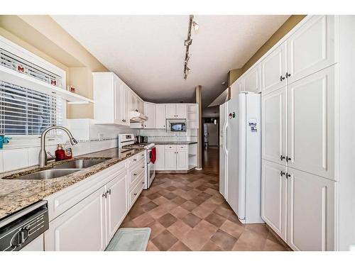 37 Christie Gardens Sw, Calgary, AB - Indoor Photo Showing Kitchen With Double Sink