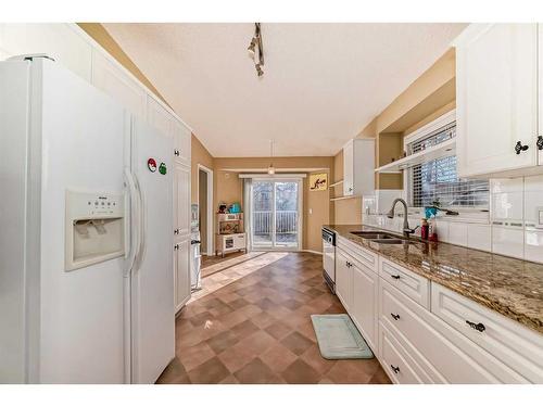 37 Christie Gardens Sw, Calgary, AB - Indoor Photo Showing Kitchen With Double Sink