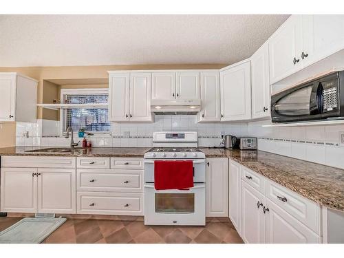 37 Christie Gardens Sw, Calgary, AB - Indoor Photo Showing Kitchen With Double Sink