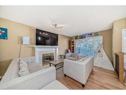 37 Christie Gardens Sw, Calgary, AB - Indoor Photo Showing Living Room With Fireplace