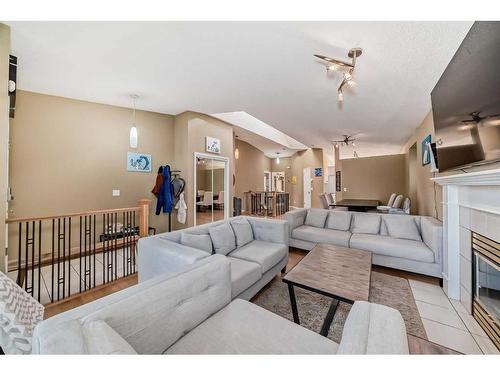 37 Christie Gardens Sw, Calgary, AB - Indoor Photo Showing Living Room With Fireplace