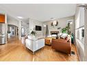 673 Victoria Beach Bay, Chestermere, AB  - Indoor Photo Showing Living Room With Fireplace 