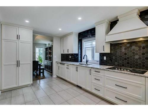 105 Pump Hill Landing Sw, Calgary, AB - Indoor Photo Showing Kitchen With Double Sink