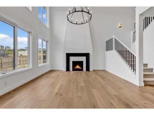 137 Creekstone Hill Sw, Calgary, AB - Indoor Photo Showing Living Room With Fireplace