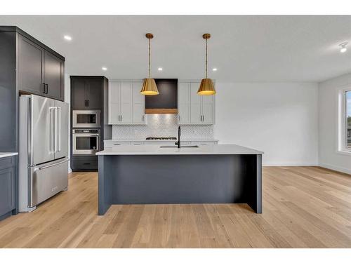 137 Creekstone Hill Sw, Calgary, AB - Indoor Photo Showing Kitchen With Upgraded Kitchen