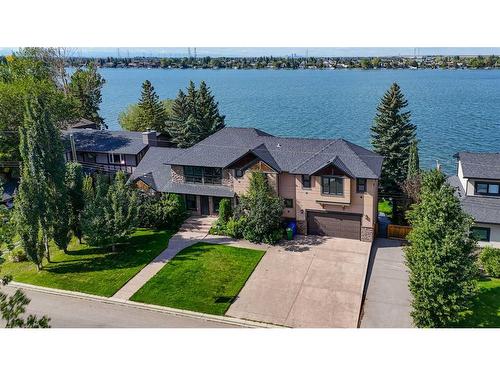 869 East Chestermere Drive, Chestermere, AB - Outdoor With Body Of Water With Facade