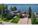 869 East Chestermere Drive, Chestermere, AB  - Outdoor With Body Of Water With Facade 