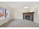 83 Bridlecrest Manor Sw, Calgary, AB  - Indoor Photo Showing Other Room With Fireplace 