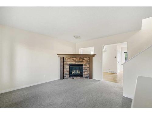 83 Bridlecrest Manor Sw, Calgary, AB - Indoor Photo Showing Living Room With Fireplace