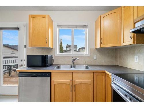 83 Bridlecrest Manor Sw, Calgary, AB - Indoor Photo Showing Kitchen With Double Sink