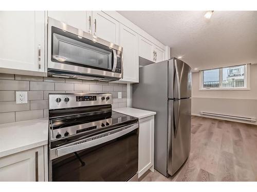 309-474 Seton Circle Se, Calgary, AB - Indoor Photo Showing Kitchen With Stainless Steel Kitchen