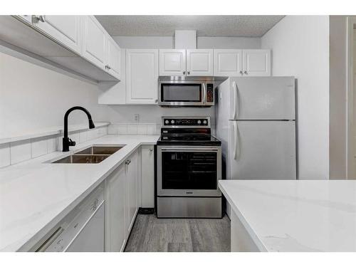 131 Stonemere Place, Chestermere, AB - Indoor Photo Showing Kitchen With Double Sink