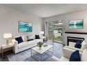 131 Stonemere Place, Chestermere, AB  - Indoor Photo Showing Living Room With Fireplace 