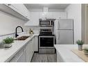 131 Stonemere Place, Chestermere, AB  - Indoor Photo Showing Kitchen With Double Sink 