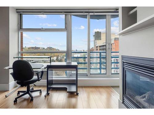 806-205 Riverfront Avenue Sw, Calgary, AB - Indoor With Fireplace