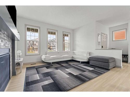 374 Evanston Way Nw, Calgary, AB - Indoor Photo Showing Living Room With Fireplace