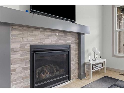 374 Evanston Way Nw, Calgary, AB - Indoor Photo Showing Living Room With Fireplace