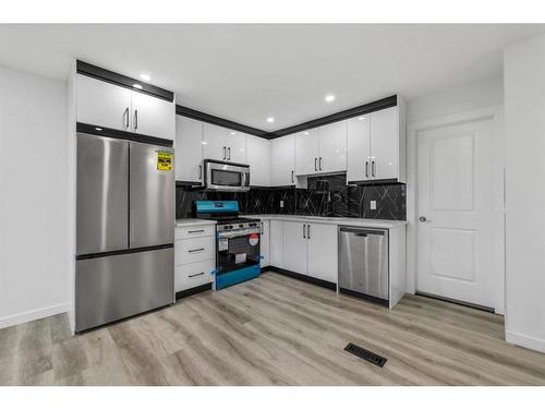 275 Rundlecairn Road Ne, Calgary, AB - Indoor Photo Showing Kitchen With Stainless Steel Kitchen