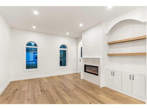 1917 21 Avenue Nw, Calgary, AB - Indoor Photo Showing Other Room With Fireplace