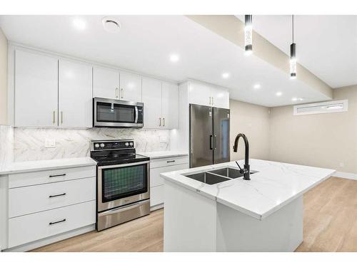 1917 21 Avenue Nw, Calgary, AB - Indoor Photo Showing Kitchen With Stainless Steel Kitchen With Double Sink With Upgraded Kitchen