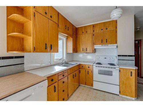 1208 Bellevue Avenue Se, Calgary, AB - Indoor Photo Showing Kitchen With Double Sink