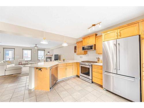 204-52 Mcrae Street, Okotoks, AB - Indoor Photo Showing Kitchen With Stainless Steel Kitchen