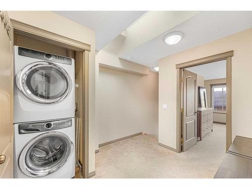 204-52 Mcrae Street, Okotoks, AB - Indoor Photo Showing Laundry Room