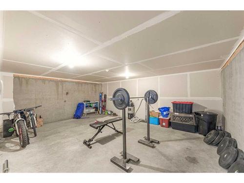 204-52 Mcrae Street, Okotoks, AB - Indoor Photo Showing Gym Room