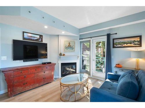 307-1235 13 Avenue Sw, Calgary, AB - Indoor Photo Showing Living Room With Fireplace