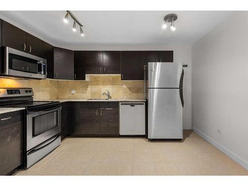 220-519 17 Avenue Sw, Calgary, AB - Indoor Photo Showing Kitchen With Stainless Steel Kitchen