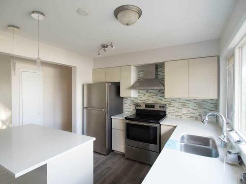 932 43 Street Sw, Calgary, AB - Indoor Photo Showing Kitchen With Double Sink