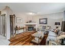 172 Tuscarora Heights Nw, Calgary, AB  - Indoor Photo Showing Living Room With Fireplace 