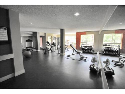 312-5115 Richard Road Sw, Calgary, AB - Indoor Photo Showing Gym Room