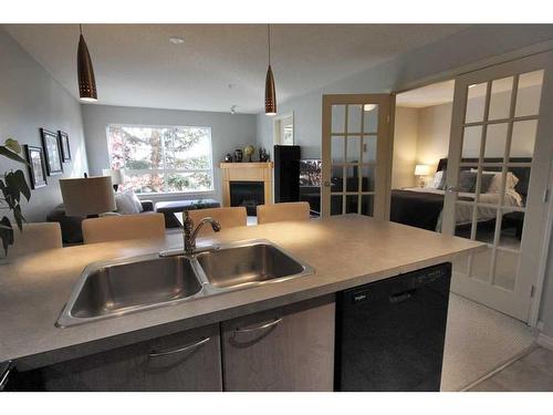 312-5115 Richard Road Sw, Calgary, AB - Indoor Photo Showing Kitchen With Double Sink