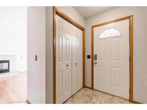 146 Arbour Stone Place Nw, Calgary, AB - Indoor Photo Showing Other Room With Fireplace