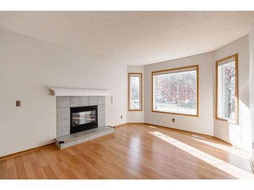 146 Arbour Stone Place Nw, Calgary, AB - Indoor Photo Showing Living Room With Fireplace