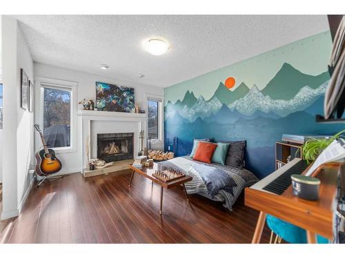 113 30 Avenue Nw, Calgary, AB - Indoor Photo Showing Living Room With Fireplace