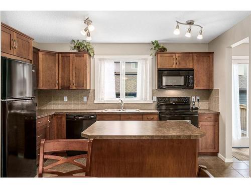 214 Panamount Way Nw, Calgary, AB - Indoor Photo Showing Kitchen With Double Sink