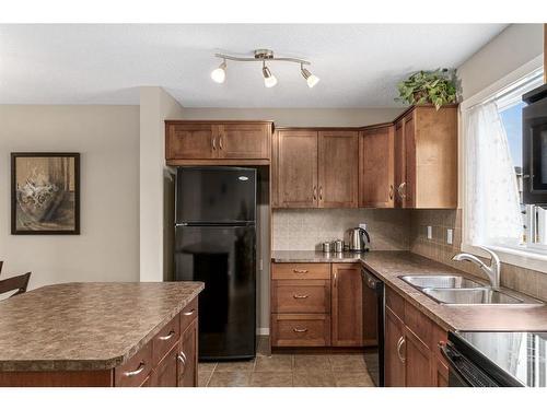 214 Panamount Way Nw, Calgary, AB - Indoor Photo Showing Kitchen With Double Sink